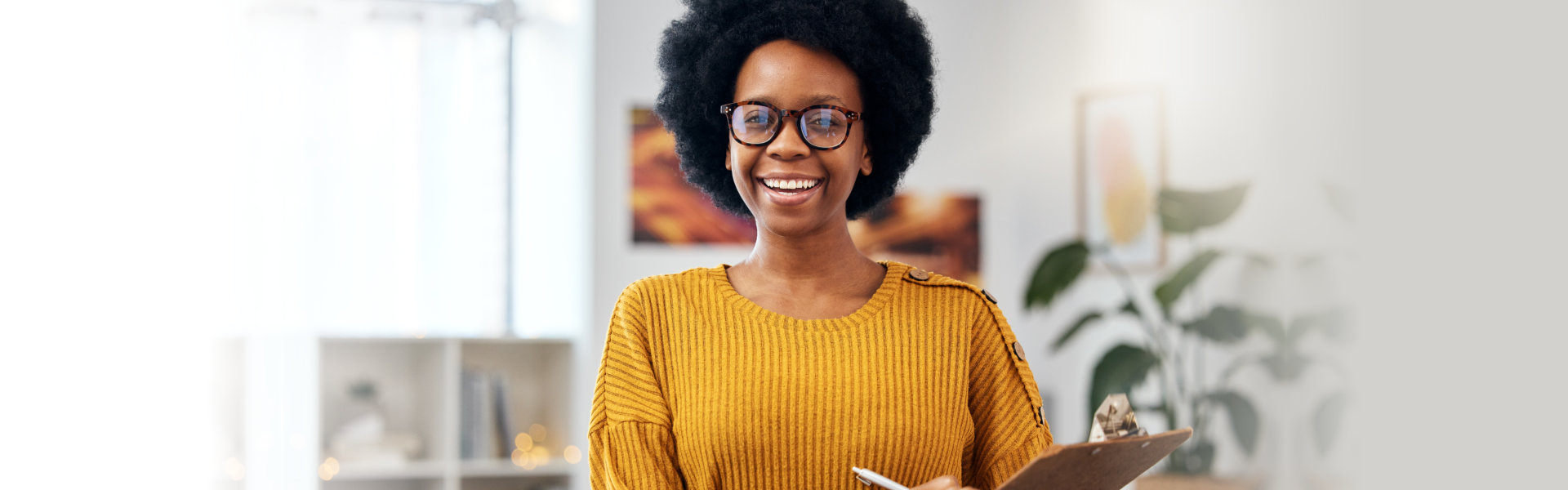 smiling woman with checklist for counselling in office